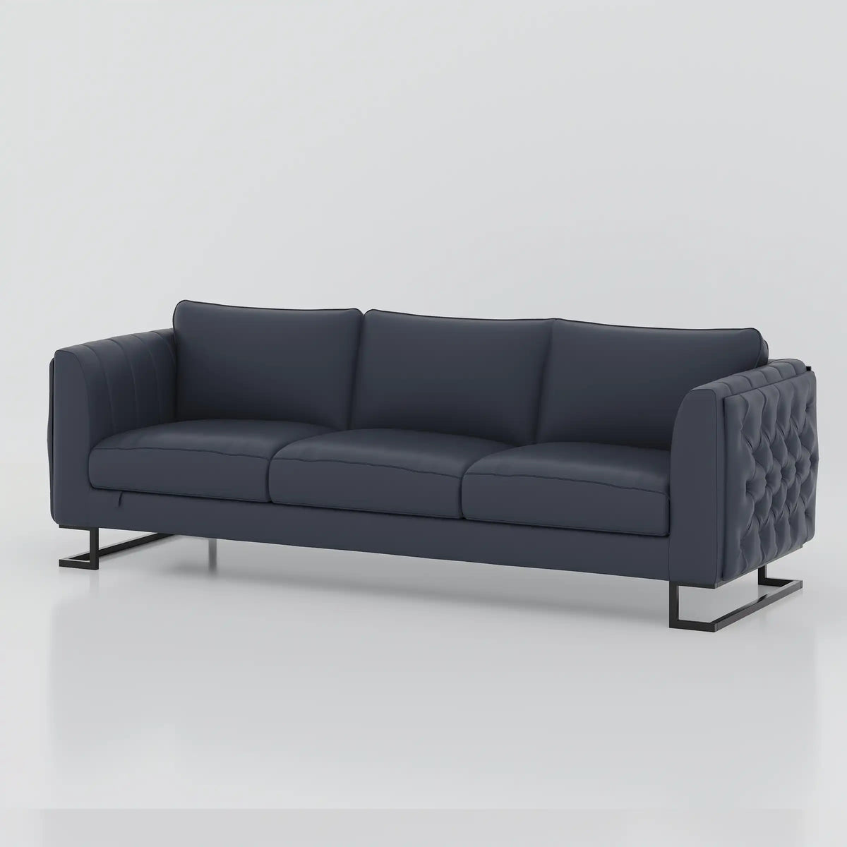 Dark blue Alden three seater sofa with tufted outer arms and raised feet, angled view.