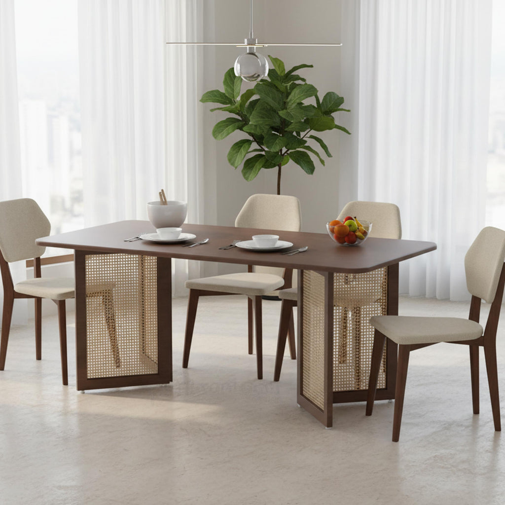 Modern dining table with a glass top, rattan accents, and sleek white base for stylish dining spaces.
