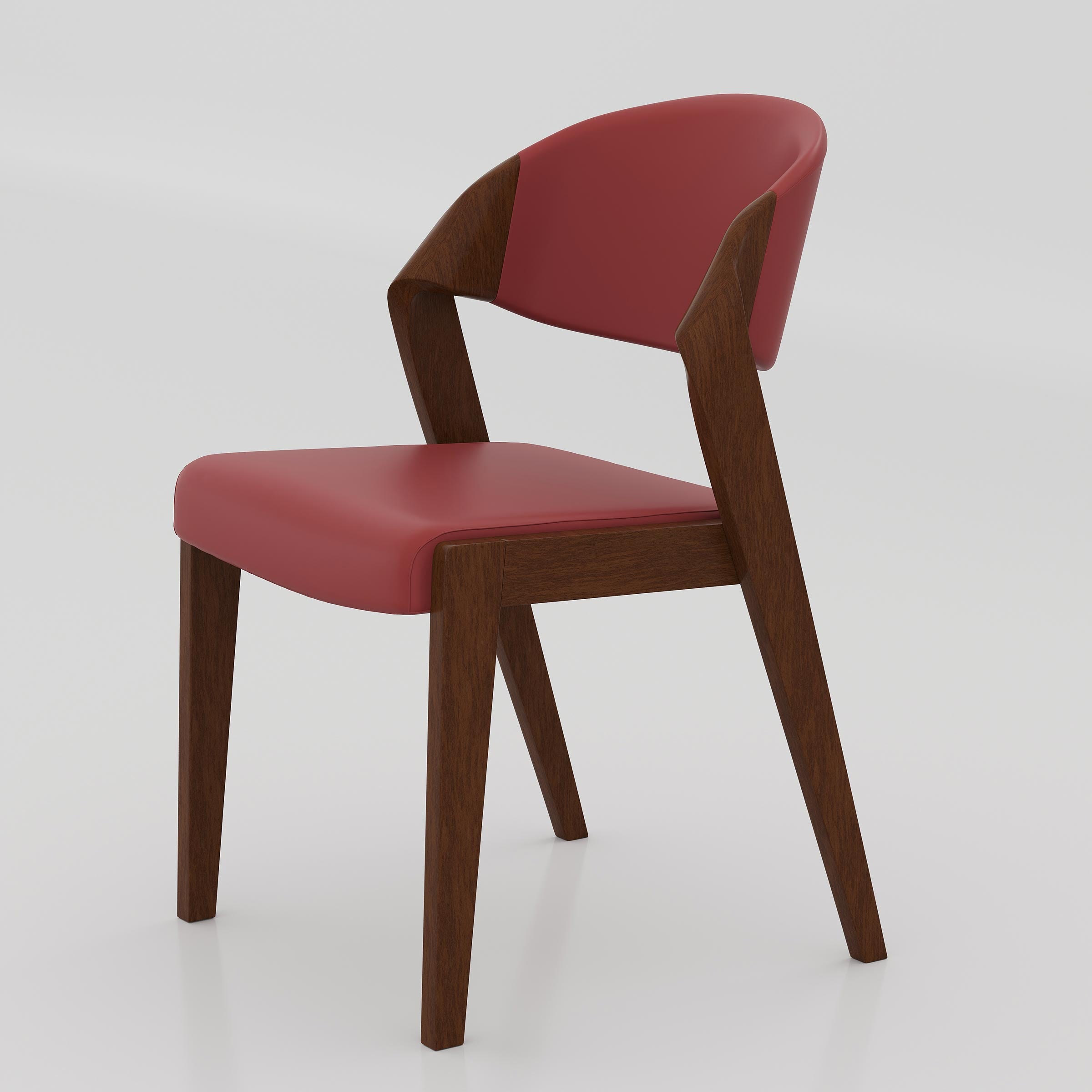 Add a premium touch to your dining room with the Kelvo Dining Chair, designed with a comfortable cushioned seat, wooden frame, and sleek modern appearance.