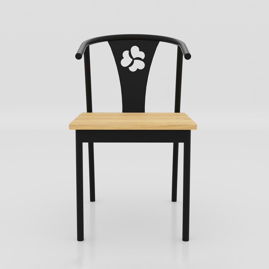 Kerox café chair with a curved back support, black metal structure and lacquer-finished seat for contemporary hospitality interiors.