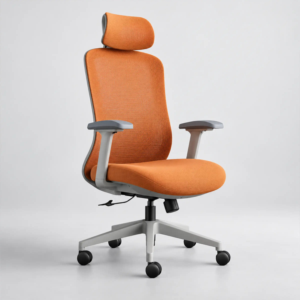 An ergonomic office chair with a bright orange textured fabric seat and backrest, a matching headrest, gray armrests, and a five-star silver metal base with black casters, shown against a light gray studio background.