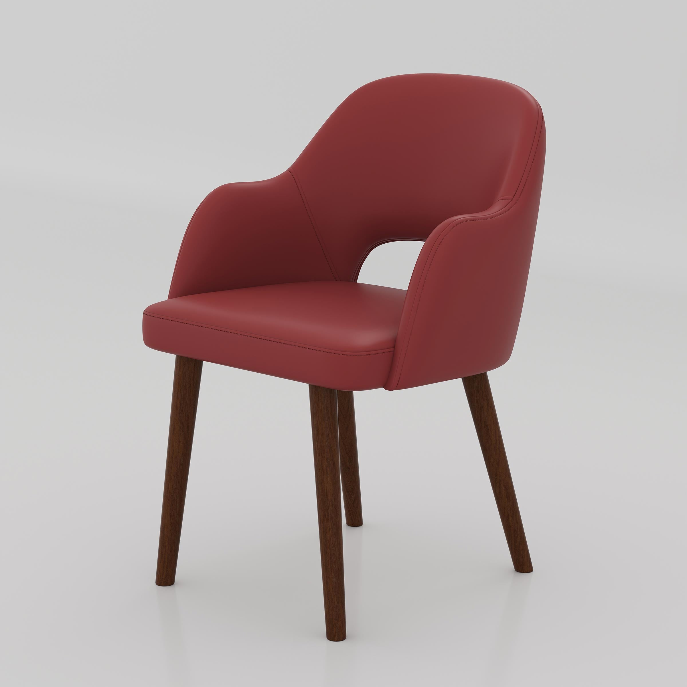 Add a premium touch to your dining room with the Ravel Dining Chair, designed with a cozy cushioned seat, elegant curved shape, and strong wooden legs.
