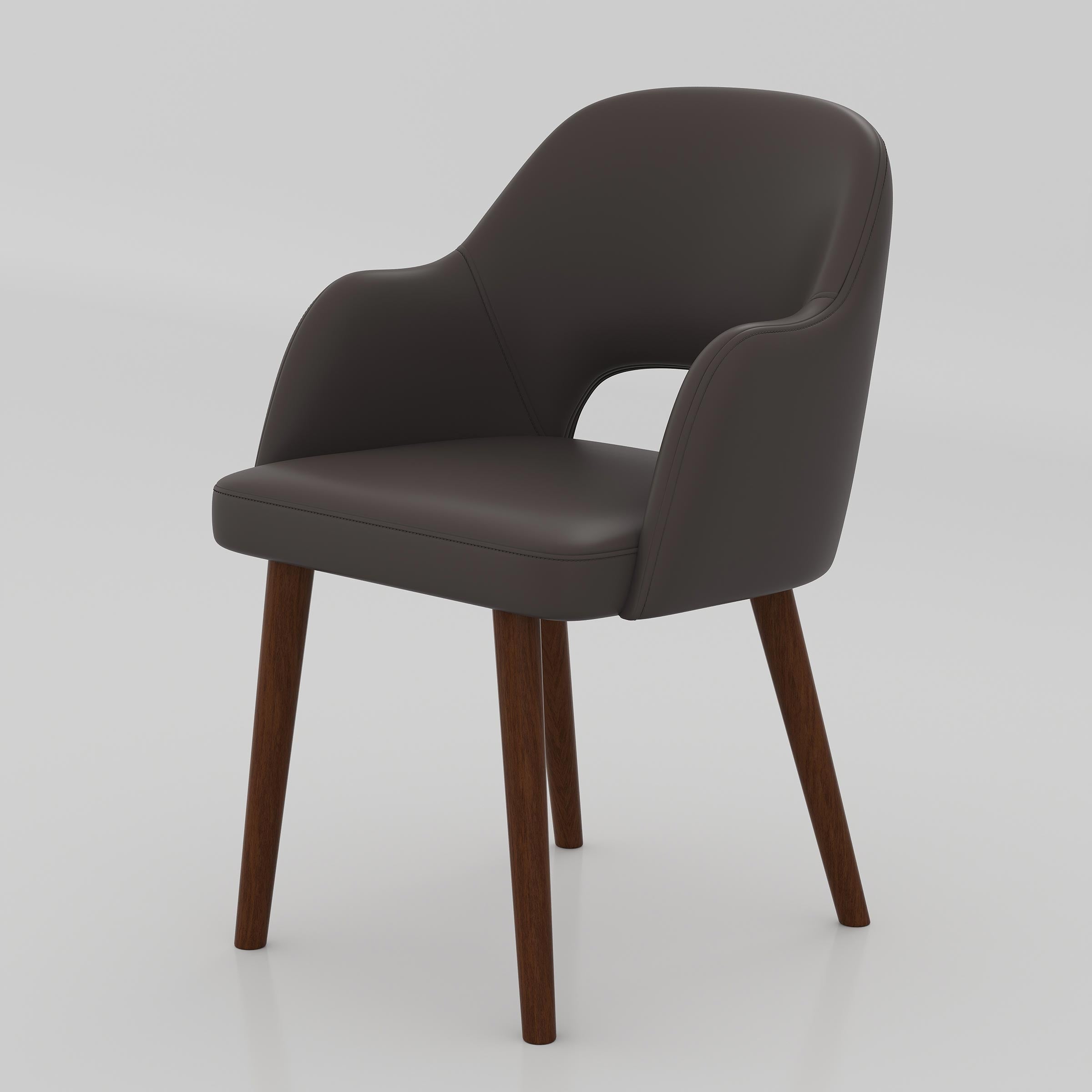 Shop the Ravel Dining Chair for a modern dining setup with comfortable seating, smooth Rexine upholstery, supportive armrest design, and stylish wooden legs.