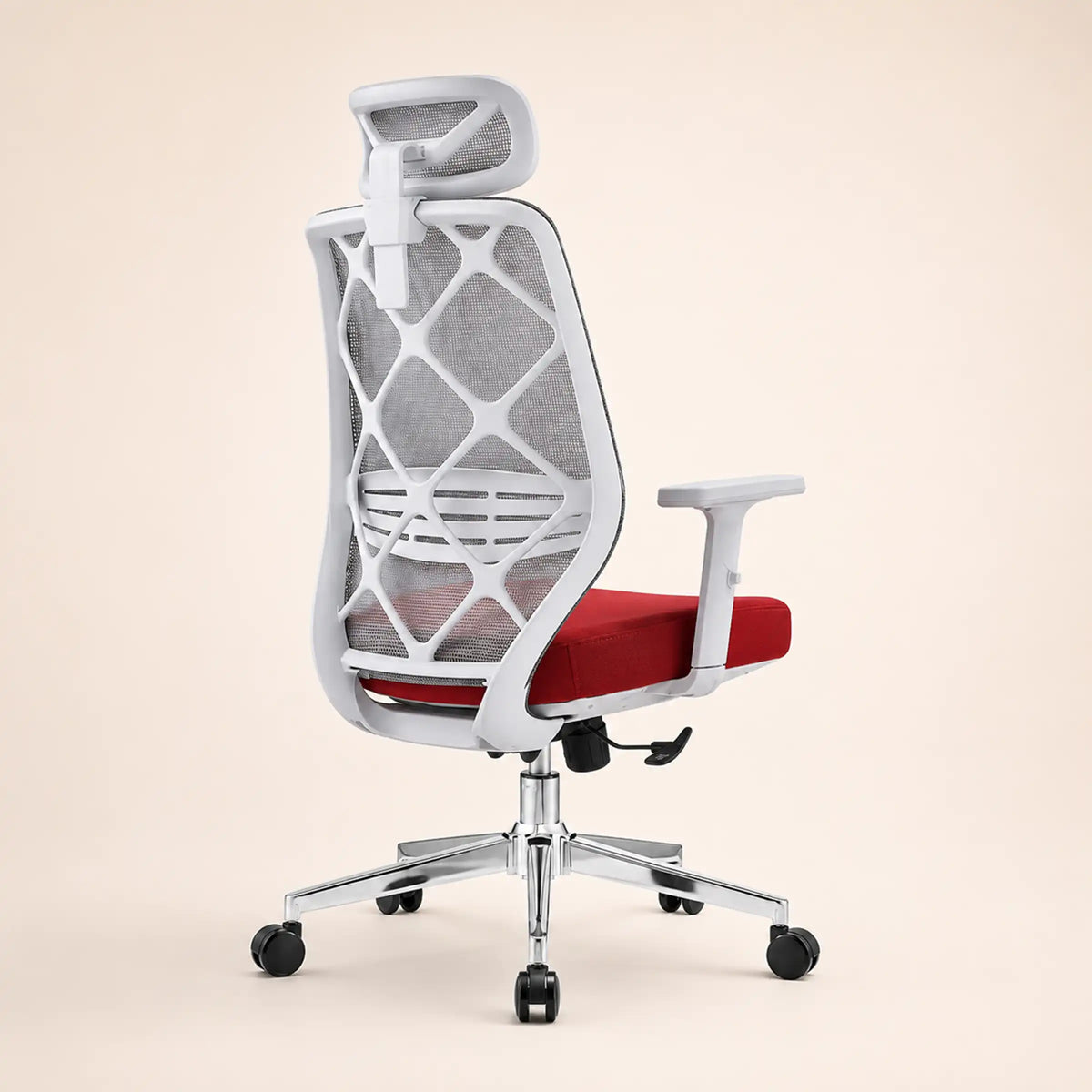 A modern ergonomic office chair with a white frame, gray mesh backrest, red seat cushion, and chrome five-wheel base, shown from the rear on a solid beige background.