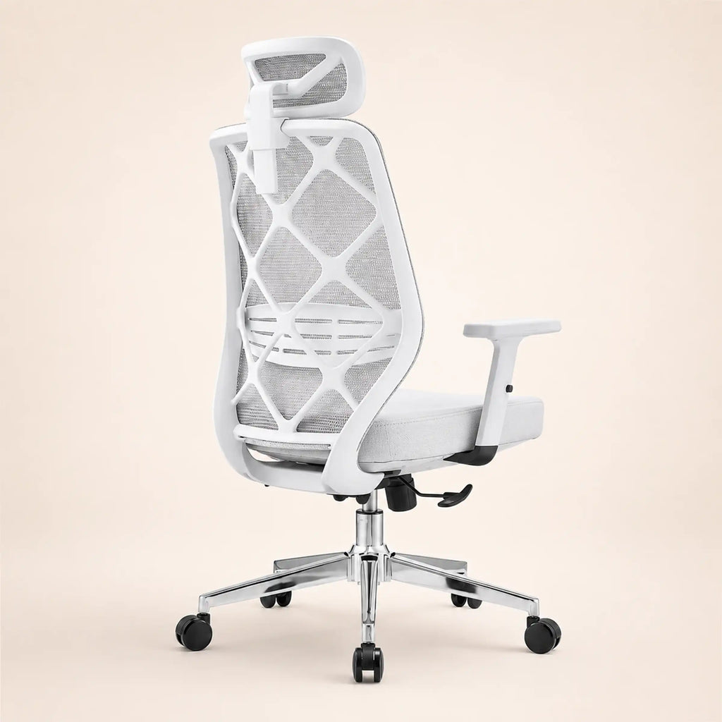 A modern white ergonomic office chair with a breathable mesh back, adjustable armrests, a headrest, and a chrome five-star wheeled base, shown against a solid light beige background.