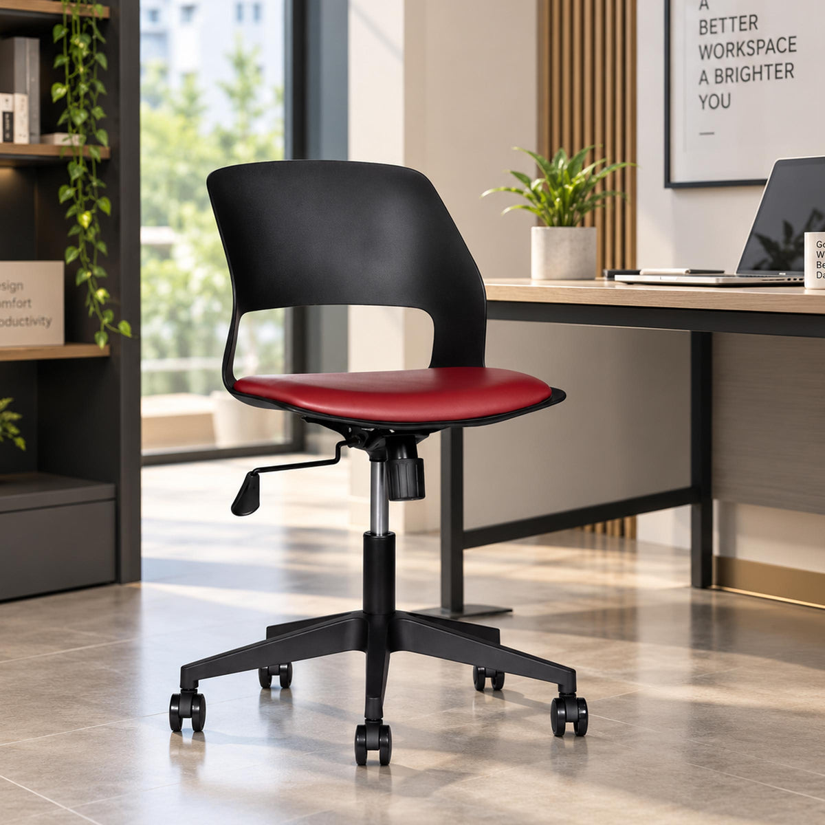 Vento Pro swivel chair with a black backrest and red seat beside an office desk.
