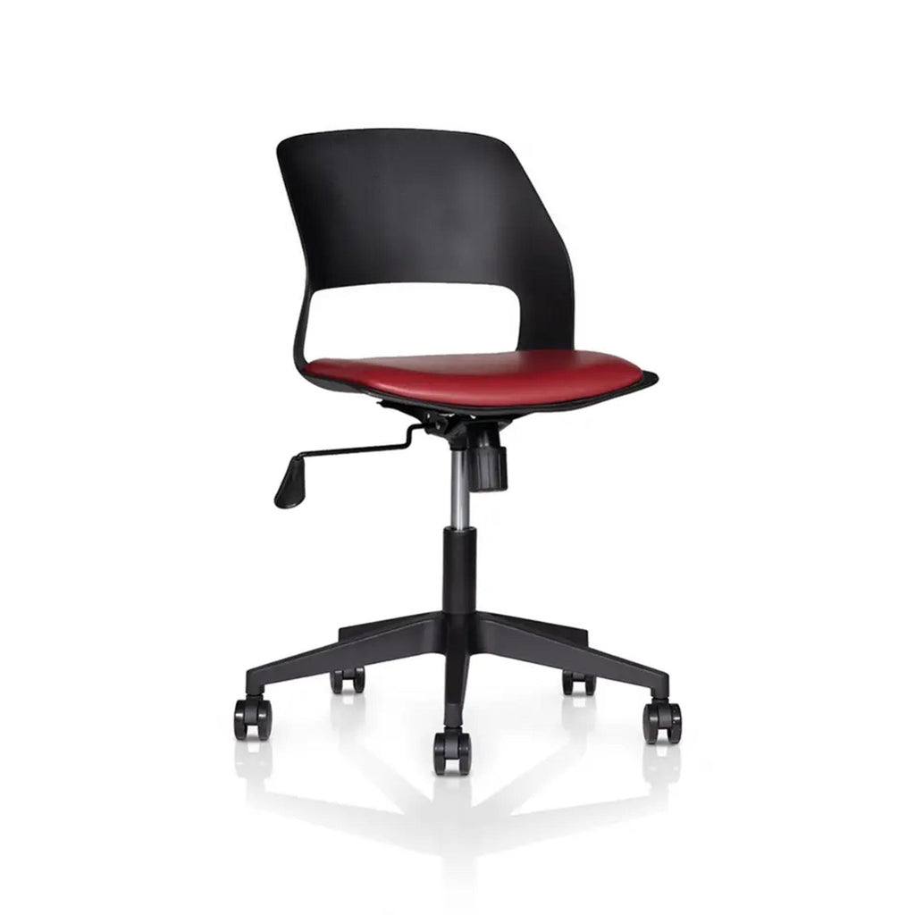 Vento Pro swivel chair with a red seat, black cutout backrest and five-spoke wheeled base, angled view.