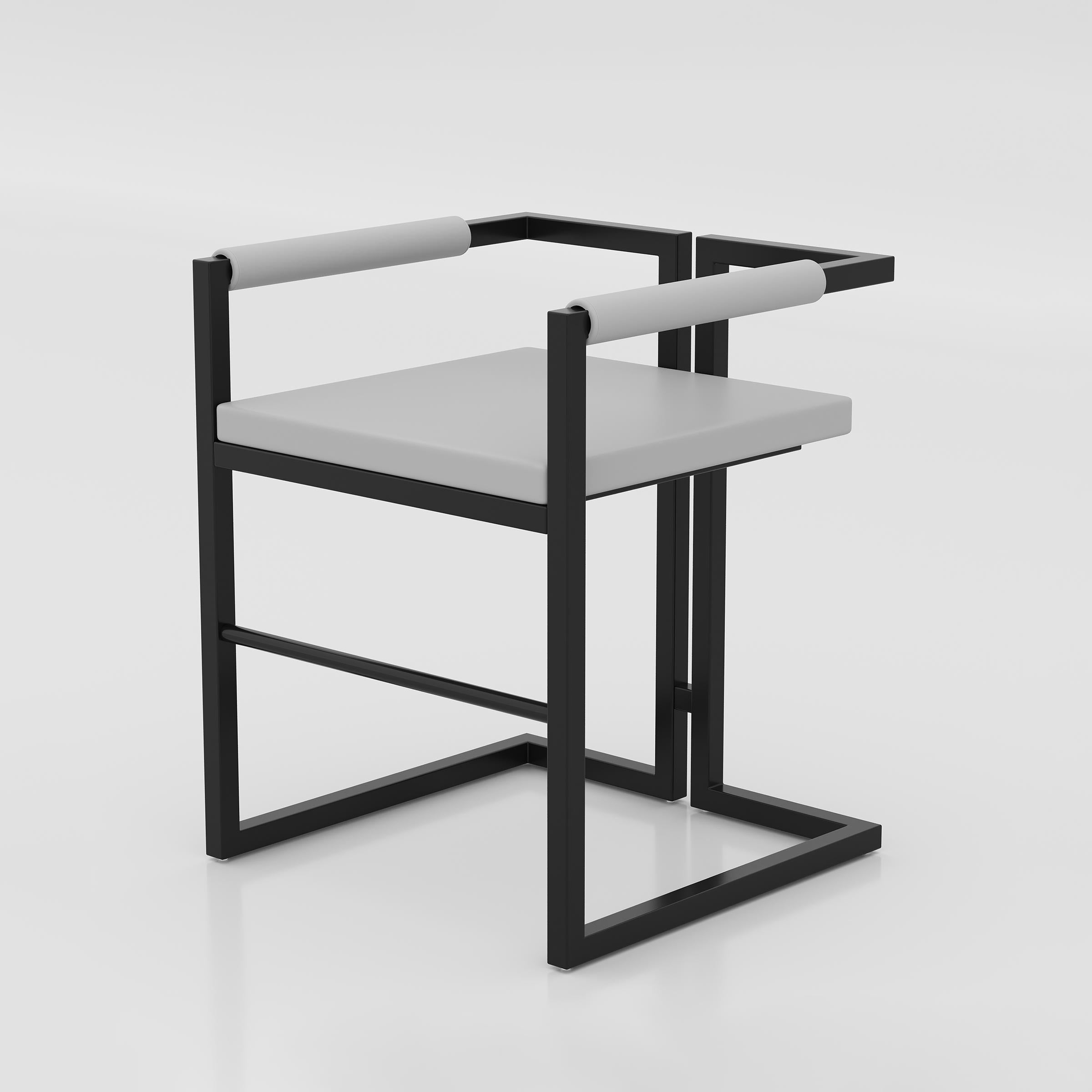 Zelon restaurant dining chair with supportive armrests, foam-cushioned rexine seating and a sturdy black MS box frame.